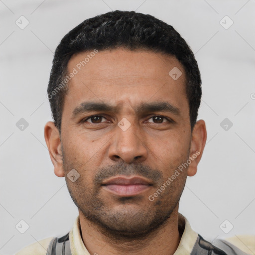 Neutral latino young-adult male with short  black hair and brown eyes