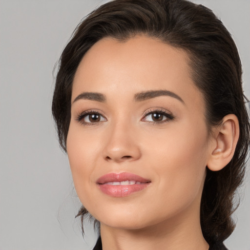 Joyful white young-adult female with medium  brown hair and brown eyes