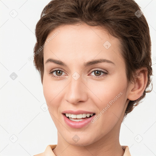 Joyful white young-adult female with short  brown hair and brown eyes