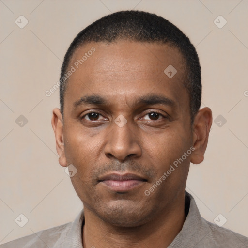 Neutral black young-adult male with short  black hair and brown eyes