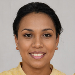 Joyful latino young-adult female with short  brown hair and brown eyes