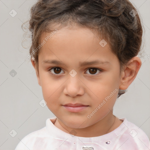 Joyful white child male with short  brown hair and brown eyes