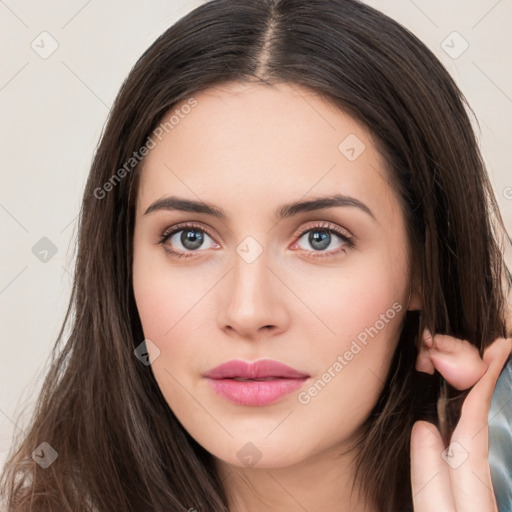 Neutral white young-adult female with long  brown hair and brown eyes