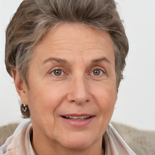 Joyful white middle-aged female with short  brown hair and brown eyes