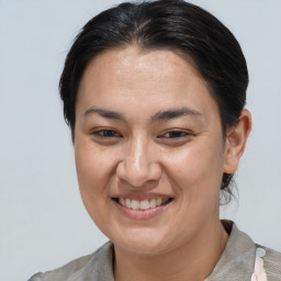 Joyful white adult female with medium  brown hair and brown eyes