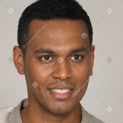 Joyful black young-adult male with short  brown hair and brown eyes