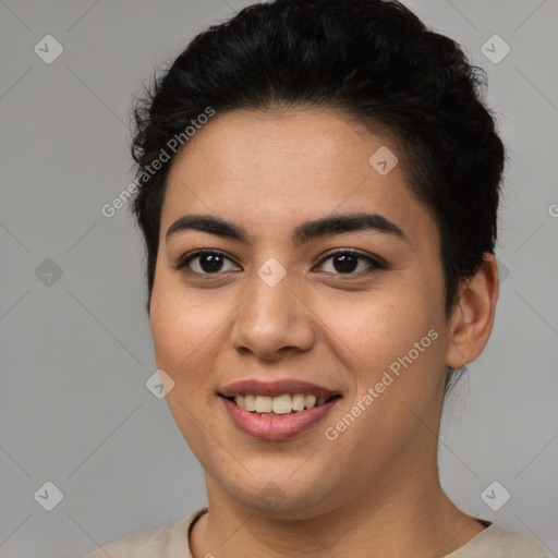 Joyful latino young-adult female with short  brown hair and brown eyes