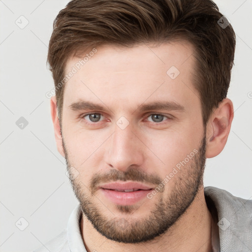 Neutral white young-adult male with short  brown hair and grey eyes