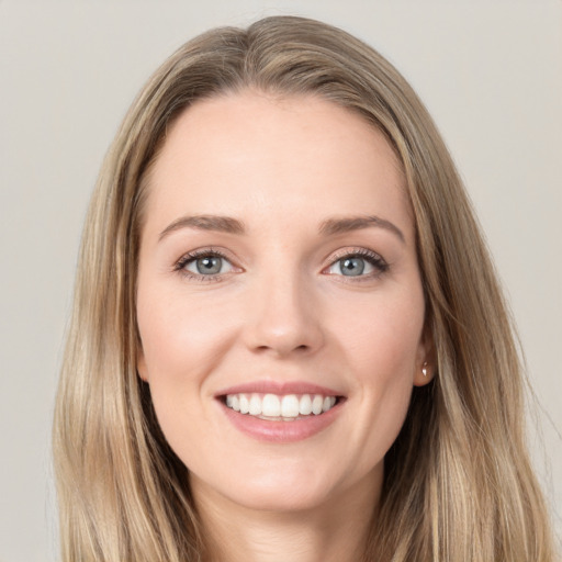 Joyful white young-adult female with long  brown hair and grey eyes