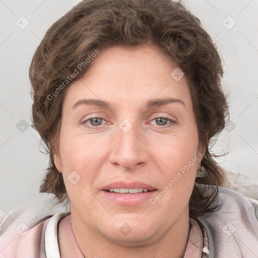 Joyful white adult female with short  brown hair and grey eyes