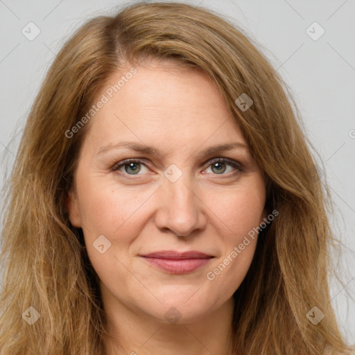 Joyful white adult female with long  brown hair and brown eyes