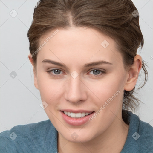 Joyful white young-adult female with medium  brown hair and blue eyes