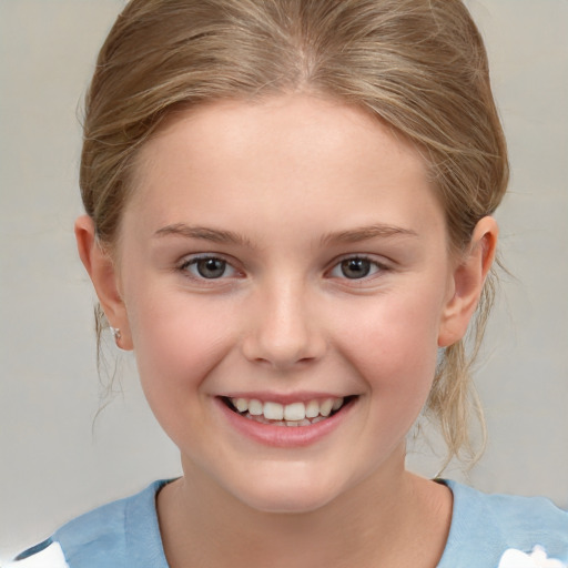 Joyful white child female with medium  brown hair and brown eyes