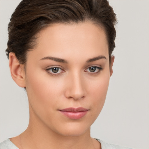 Neutral white young-adult female with short  brown hair and brown eyes