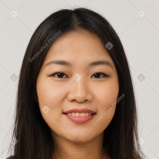 Joyful latino young-adult female with long  brown hair and brown eyes