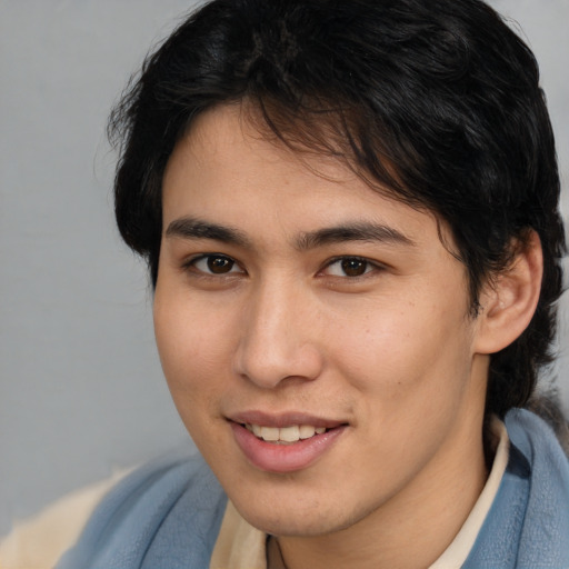 Joyful white young-adult male with medium  brown hair and brown eyes