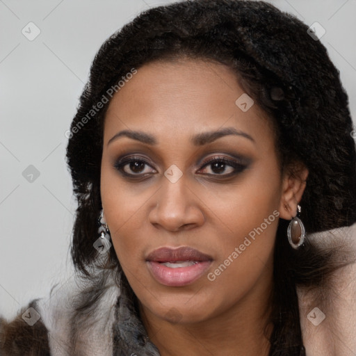 Joyful black young-adult female with long  brown hair and brown eyes