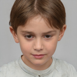 Joyful white child female with short  brown hair and brown eyes