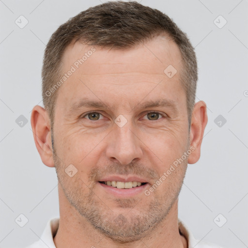 Joyful white adult male with short  brown hair and brown eyes