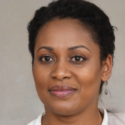 Joyful black young-adult female with medium  brown hair and brown eyes