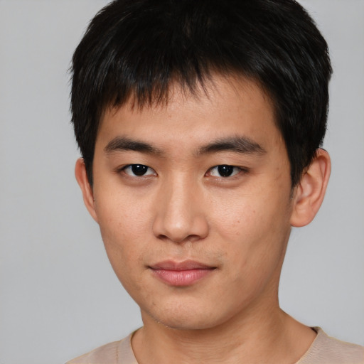 Neutral asian young-adult male with short  brown hair and brown eyes