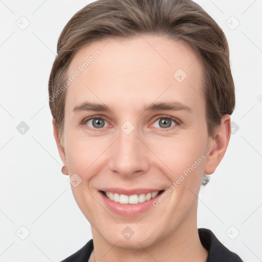 Joyful white young-adult female with short  brown hair and grey eyes