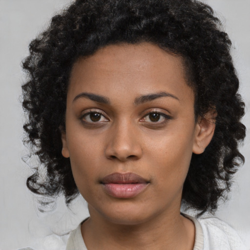 Neutral black young-adult female with medium  black hair and brown eyes