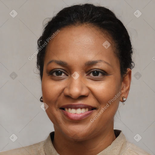 Joyful latino adult female with short  brown hair and brown eyes