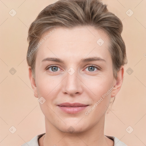 Joyful white young-adult female with short  brown hair and grey eyes