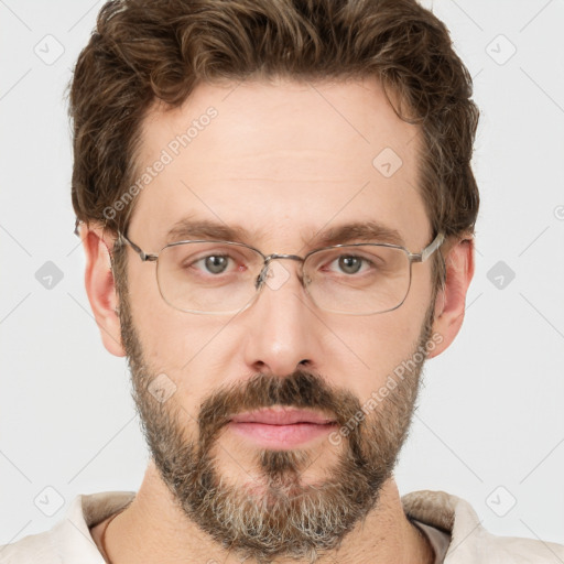 Joyful white adult male with short  brown hair and grey eyes