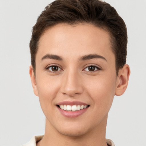 Joyful white young-adult female with short  brown hair and brown eyes