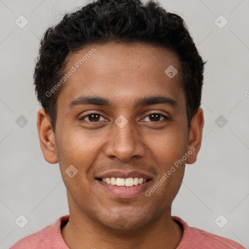 Joyful black young-adult male with short  brown hair and brown eyes