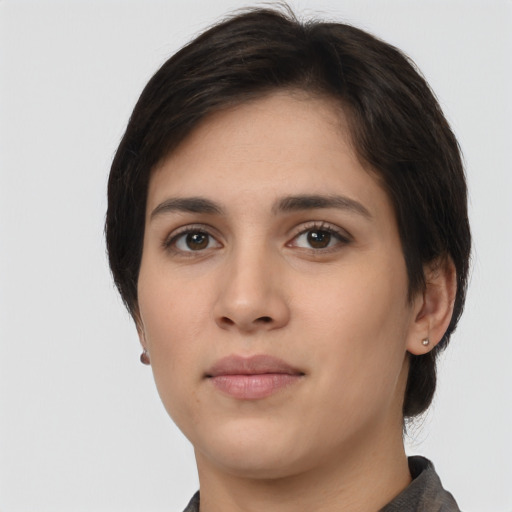 Neutral white young-adult female with short  black hair and brown eyes