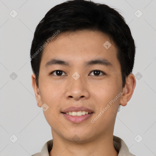 Joyful asian young-adult male with short  black hair and brown eyes