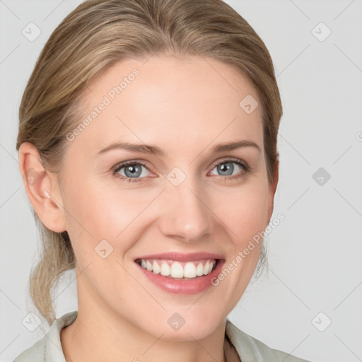 Joyful white young-adult female with medium  brown hair and blue eyes