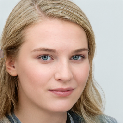 Joyful white young-adult female with long  brown hair and blue eyes