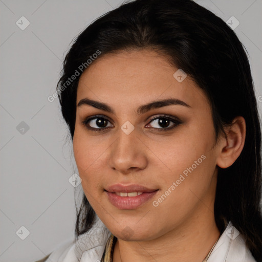 Joyful latino young-adult female with medium  brown hair and brown eyes