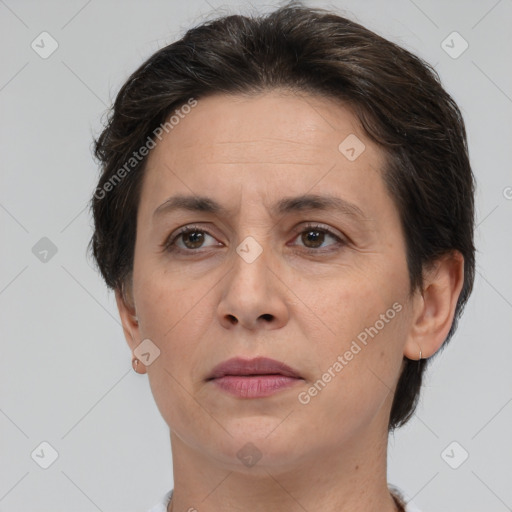 Joyful white adult female with short  brown hair and brown eyes