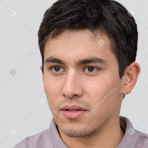 Neutral white young-adult male with short  black hair and brown eyes