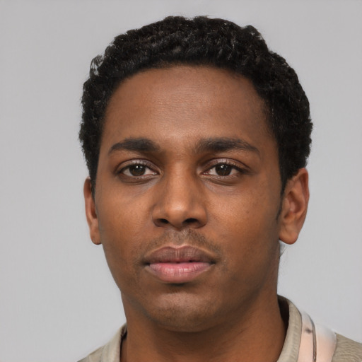 Neutral black young-adult male with short  black hair and brown eyes