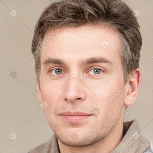 Neutral white young-adult male with short  brown hair and grey eyes