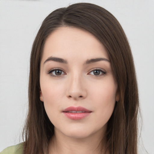 Neutral white young-adult female with long  brown hair and brown eyes