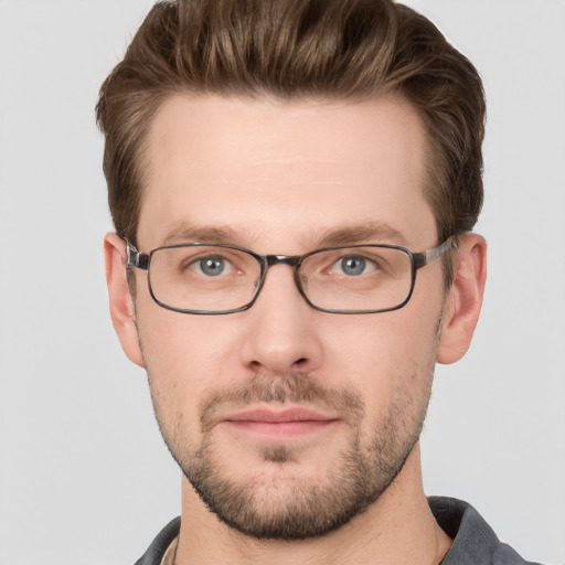 Joyful white adult male with short  brown hair and grey eyes