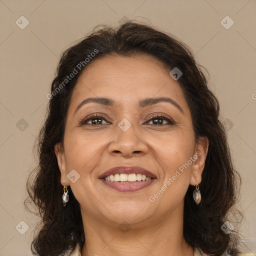 Joyful white adult female with long  brown hair and brown eyes