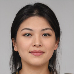 Joyful asian young-adult female with medium  black hair and brown eyes