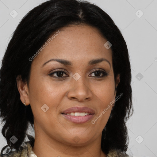 Joyful latino adult female with medium  brown hair and brown eyes