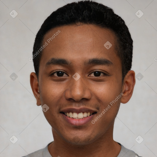 Joyful black young-adult male with short  black hair and brown eyes