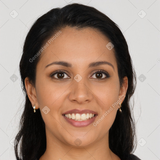 Joyful latino young-adult female with long  brown hair and brown eyes