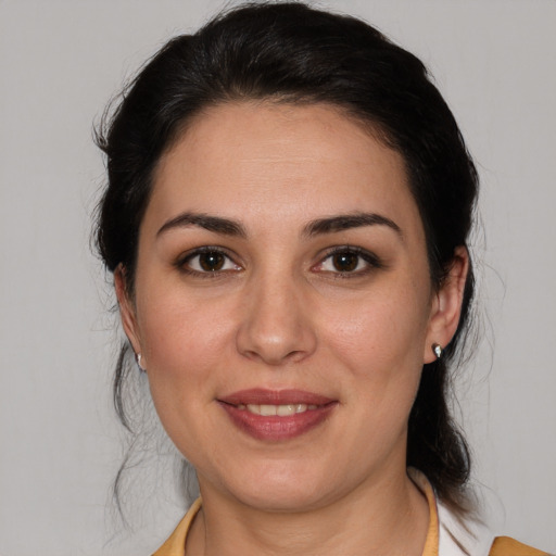 Joyful white young-adult female with medium  brown hair and brown eyes