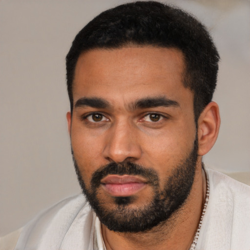 Neutral black young-adult male with short  black hair and brown eyes